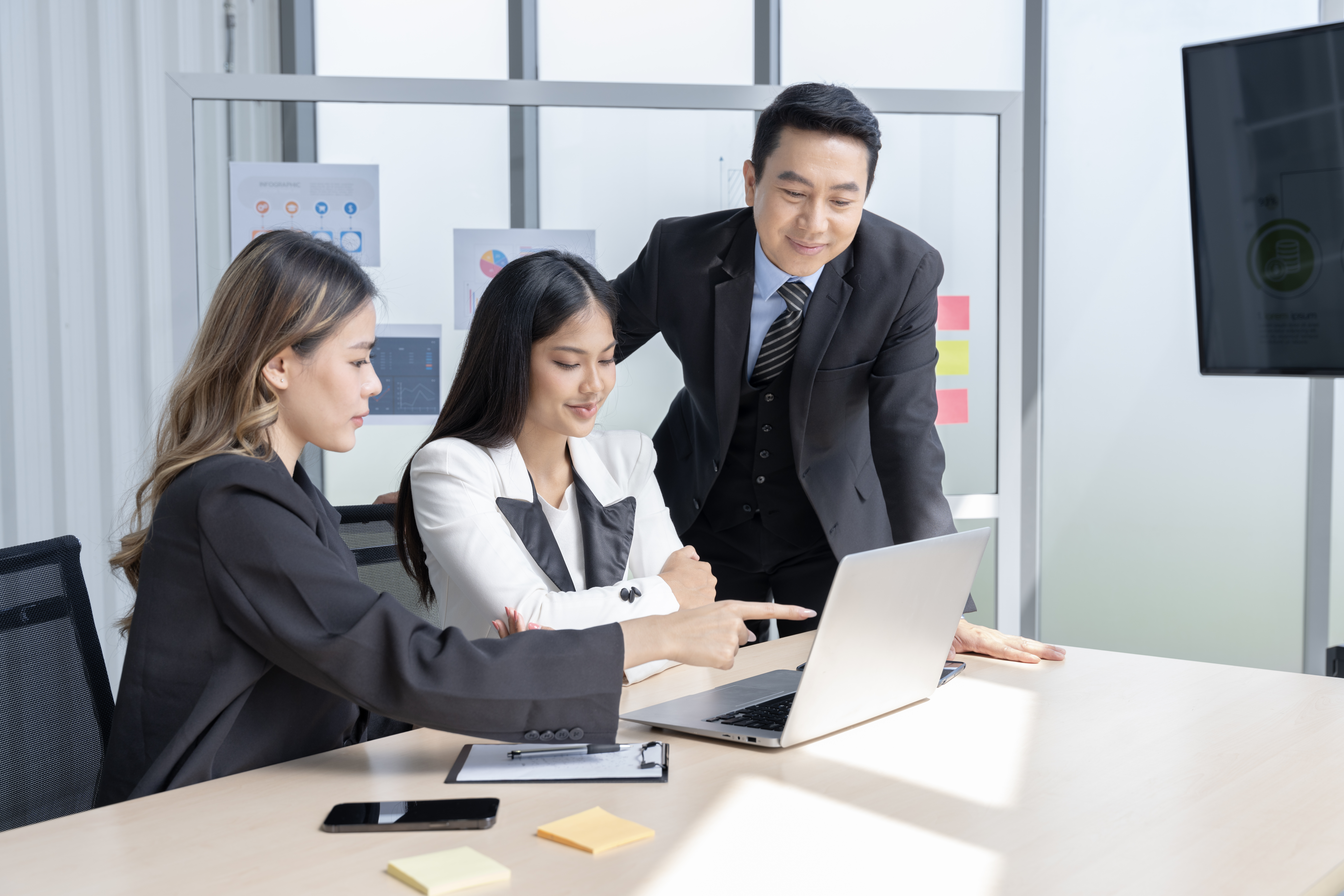 A corporate team analyzing performance metrics and refining lead generation funnels for growth.