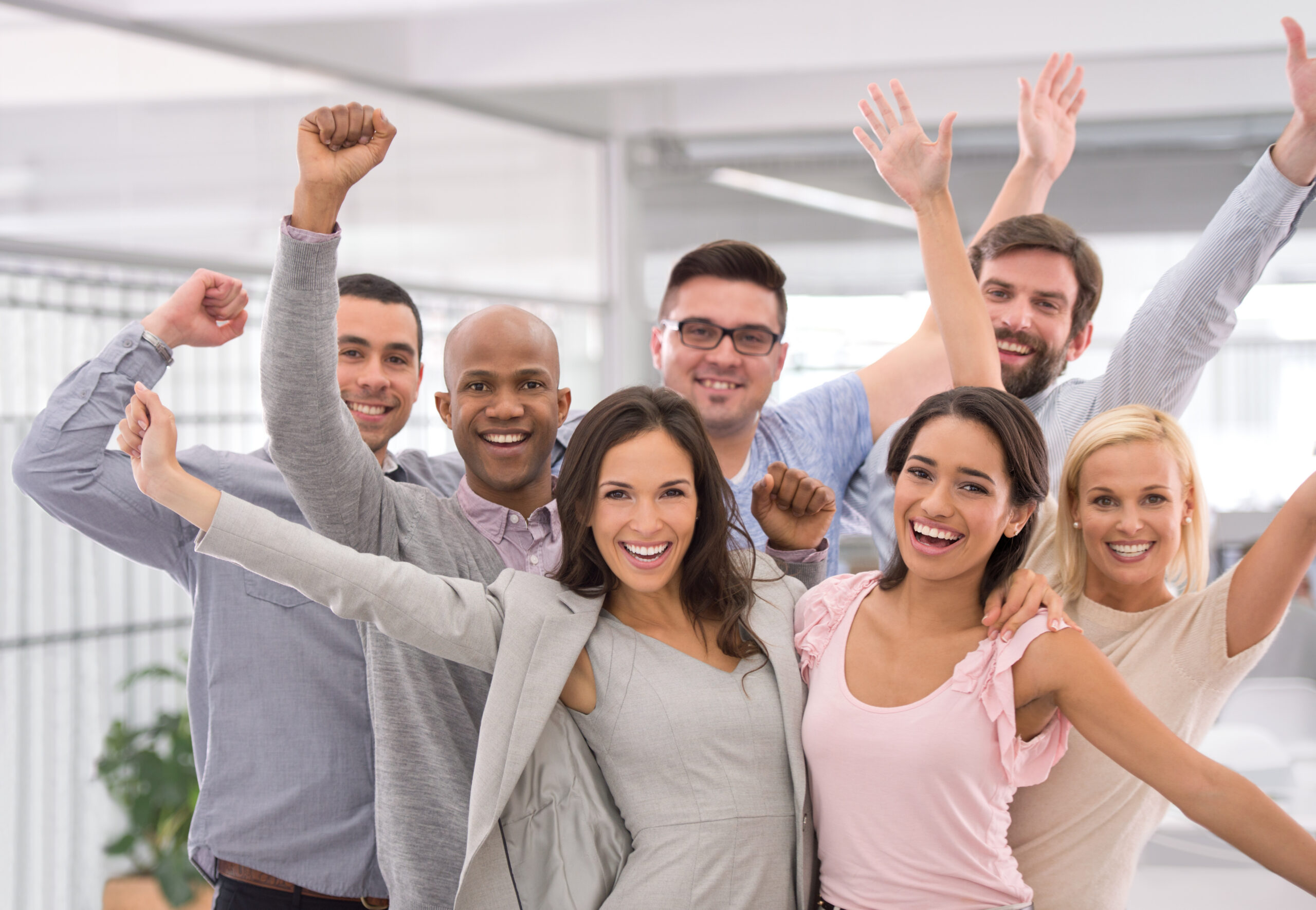 Energetic professionals celebrating hard work, motivation, and shared team success.